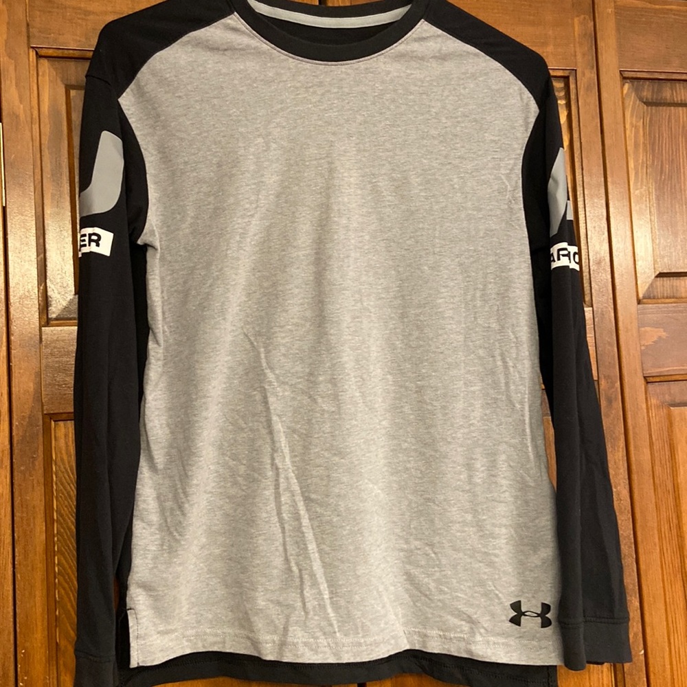 Gray front, black back.  Under Armour emblem on each sleeve.